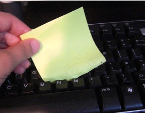 clean keyboard dust with sticky notes