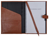 wirebound weekly monthly planner in camel colored leather jacket